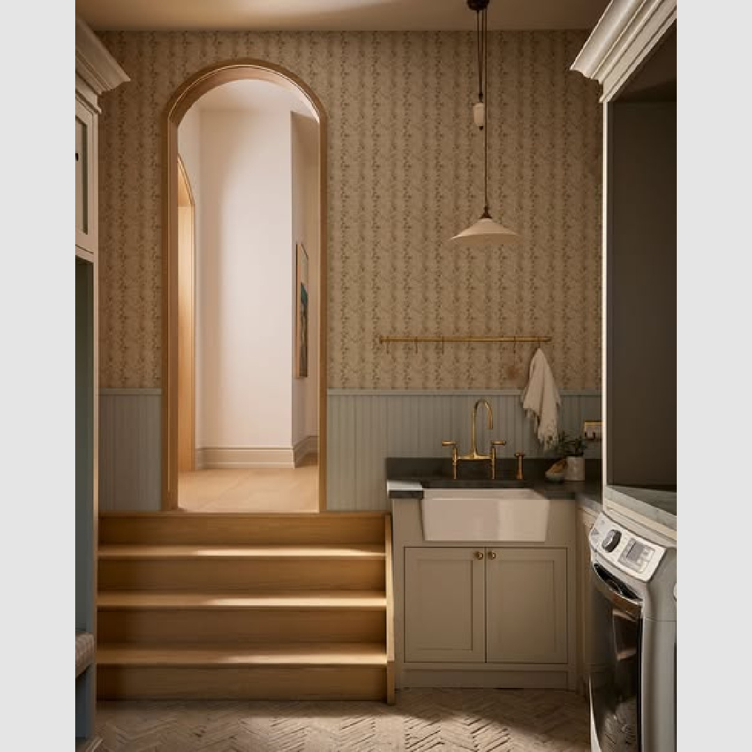 Moody light in a laundry room with sophisticated simplicity by Ashley Montgomery Design.