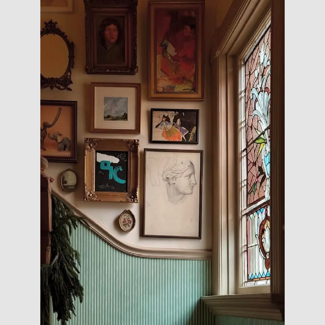 Charming gallery wall and green beadboard at stairs - Kate Pearce Vintage.